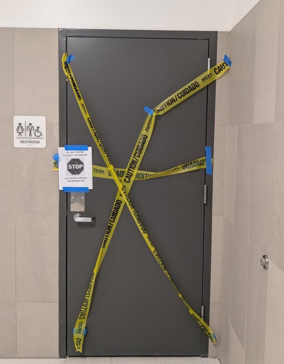 Caution tape around the bathroom door