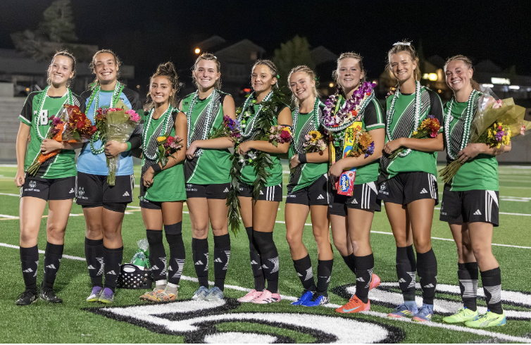 Senior Soccer Players Pose for a Photo