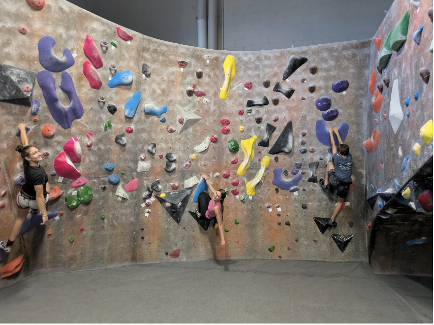 Climbers bouldering at the Sandy Momentum Gym